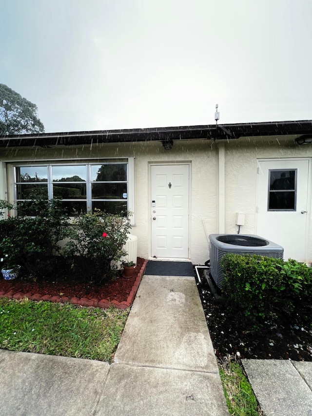 property entrance with central AC unit