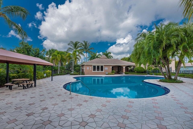 view of swimming pool with a patio area