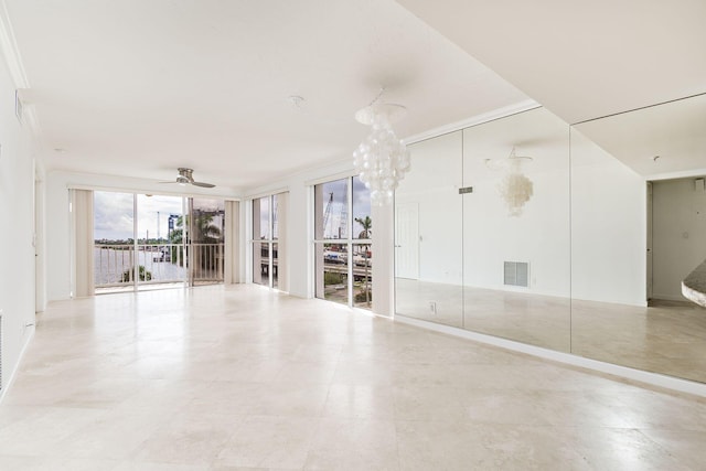 unfurnished room with crown molding and ceiling fan with notable chandelier