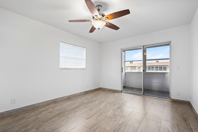 spare room with ceiling fan