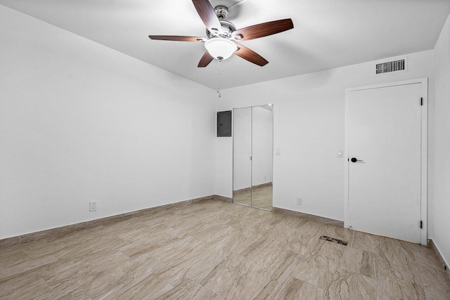 unfurnished bedroom featuring electric panel and ceiling fan