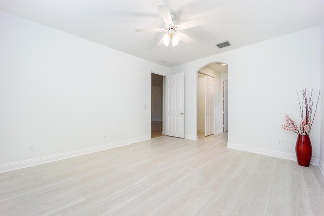 unfurnished room featuring ceiling fan and light hardwood / wood-style flooring