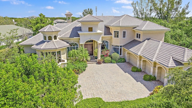 mediterranean / spanish house featuring a garage