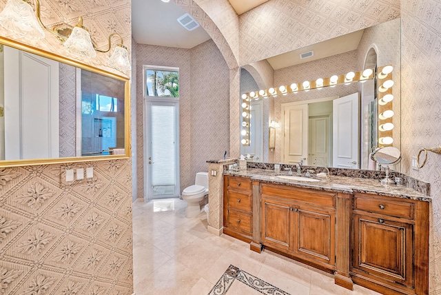 bathroom with vanity and toilet