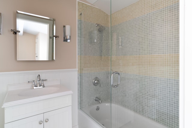 bathroom featuring vanity and shower / bath combination with glass door