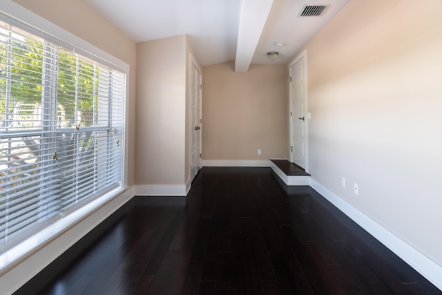 hall with beamed ceiling and dark wood-type flooring