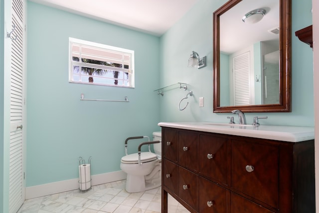 bathroom with vanity and toilet