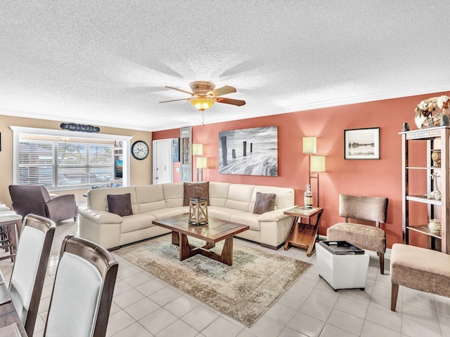 tiled living room featuring ceiling fan and a textured ceiling