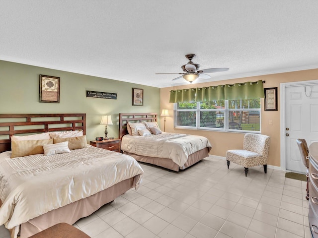 tiled bedroom featuring a textured ceiling, ceiling fan, and crown molding