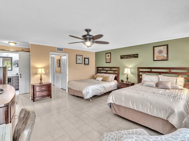 bedroom featuring a textured ceiling, ceiling fan, ornamental molding, and connected bathroom