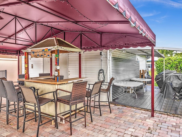 view of patio / terrace featuring an outdoor bar