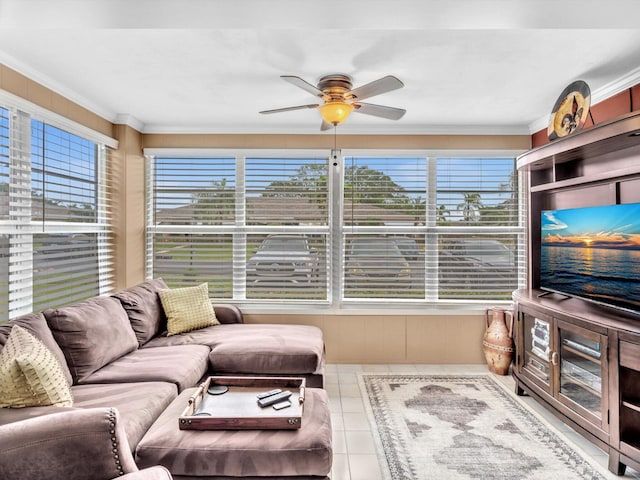 living room with ceiling fan, light tile patterned floors, and ornamental molding