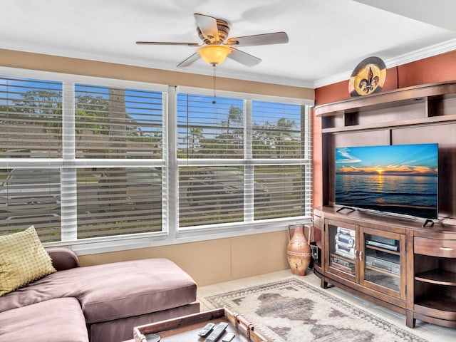 living room featuring ceiling fan and ornamental molding