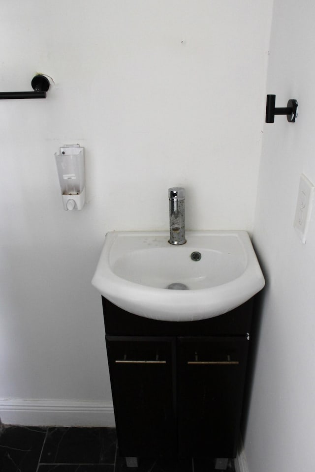 bathroom featuring tile patterned floors and vanity