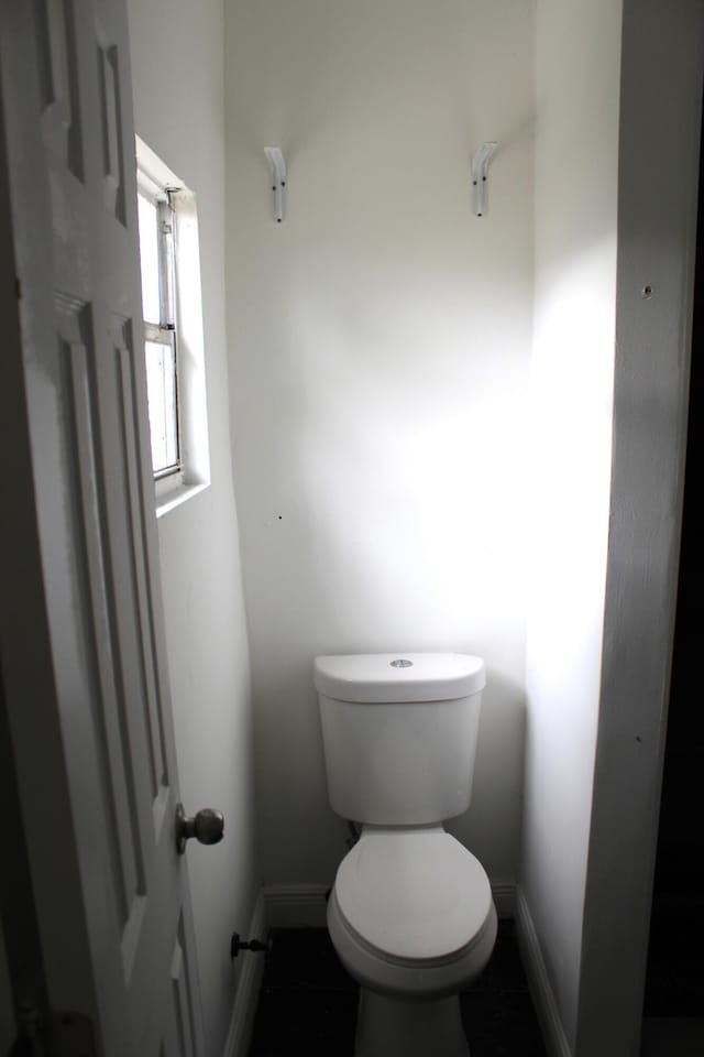 bathroom featuring tile patterned flooring and toilet