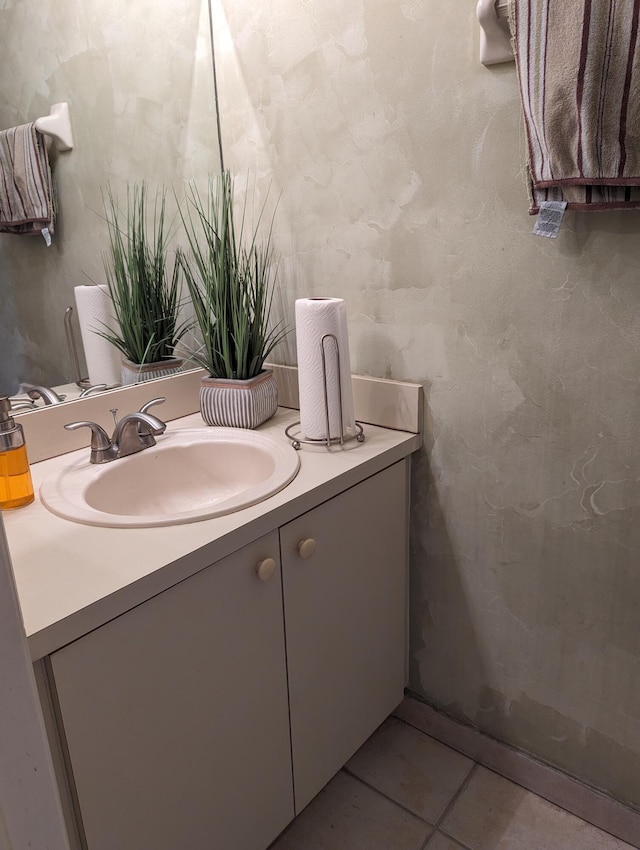 bathroom with tile patterned floors and vanity