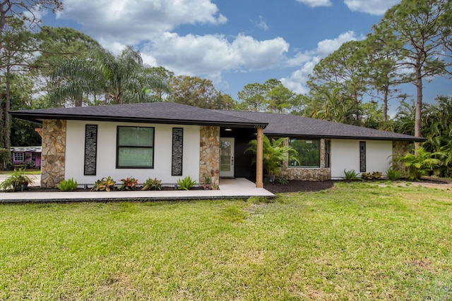 single story home with a front yard