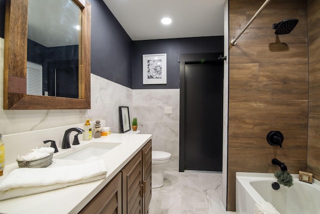 full bathroom with vanity, toilet, tile walls, and tiled shower / bath combo