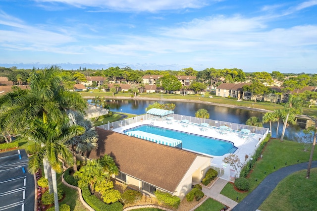 view of pool with a water view