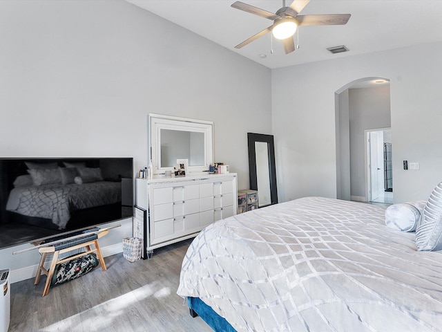 bedroom with wood-type flooring and ceiling fan