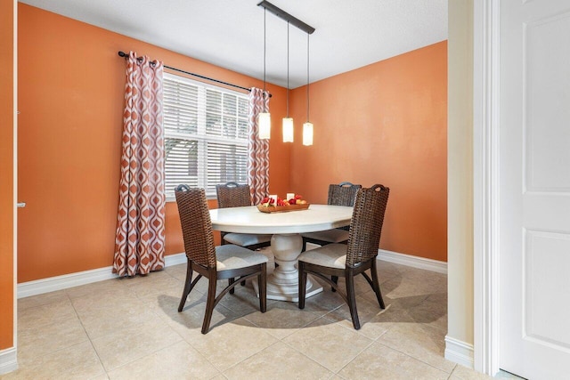 dining space with light tile patterned flooring