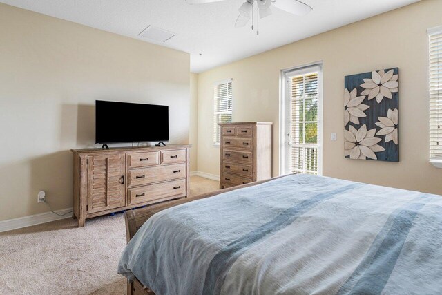 bedroom featuring light carpet and ceiling fan