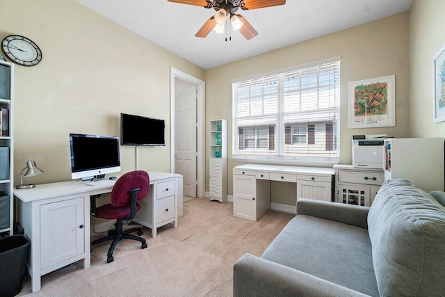 office with ceiling fan and light colored carpet