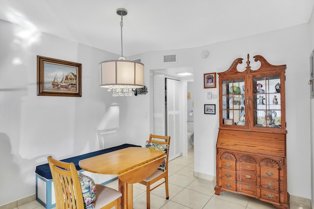 dining space with light tile patterned floors