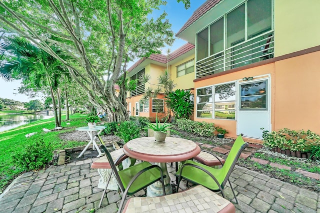 view of patio featuring a water view