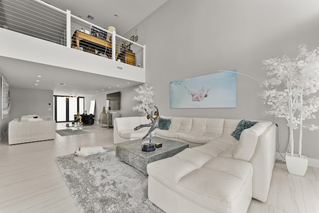 living room featuring a high ceiling