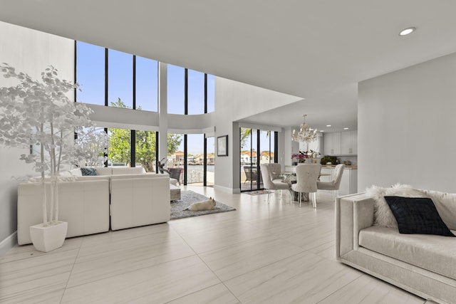 tiled living room featuring a chandelier