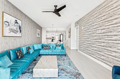 living room with hardwood / wood-style flooring and ceiling fan