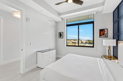 bedroom with light hardwood / wood-style flooring and ceiling fan