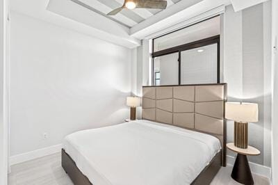 bedroom featuring ceiling fan and light wood-type flooring