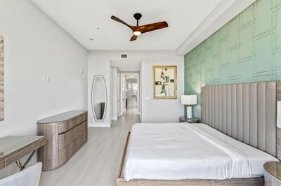 bedroom featuring ceiling fan and light hardwood / wood-style floors