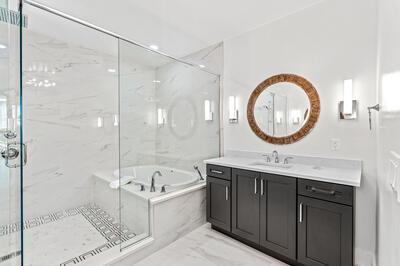 bathroom featuring vanity and shower with separate bathtub