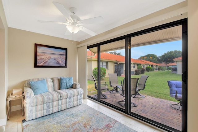 tiled living room featuring ceiling fan