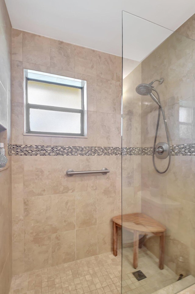 bathroom with tiled shower