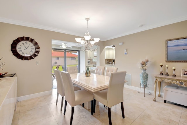 tiled dining space with ceiling fan with notable chandelier and crown molding