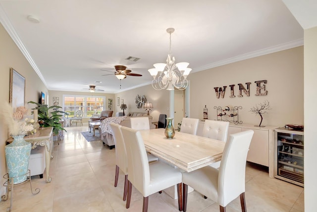 dining space featuring light tile patterned floors, ceiling fan with notable chandelier, beverage cooler, and crown molding