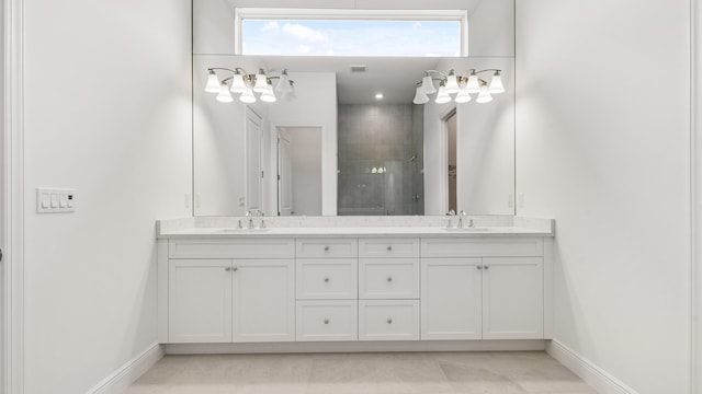 bathroom with vanity, tile patterned floors, and a shower with shower door