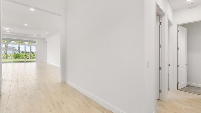 hallway with light hardwood / wood-style flooring