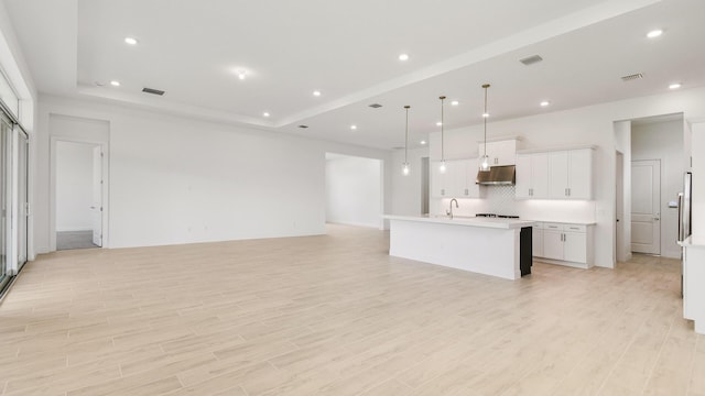 living room featuring light hardwood / wood-style floors and sink