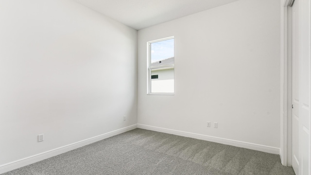 unfurnished room featuring carpet flooring