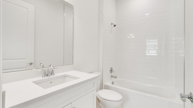 full bathroom with vanity, toilet, and tiled shower / bath