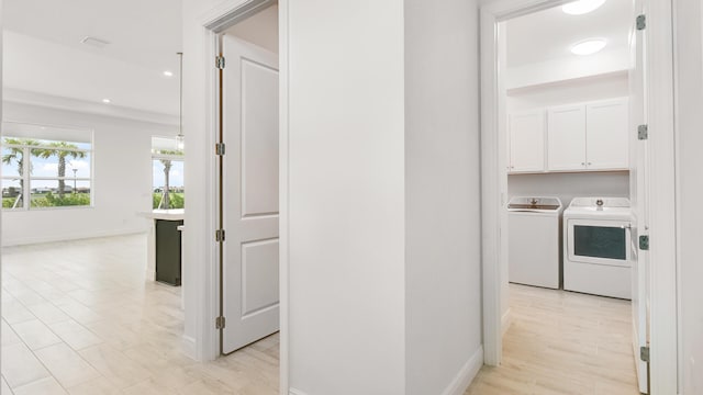 hallway with washer and dryer