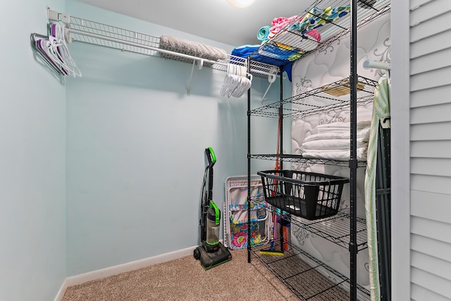 spacious closet with carpet flooring