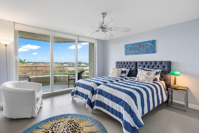 bedroom featuring expansive windows, access to exterior, and ceiling fan