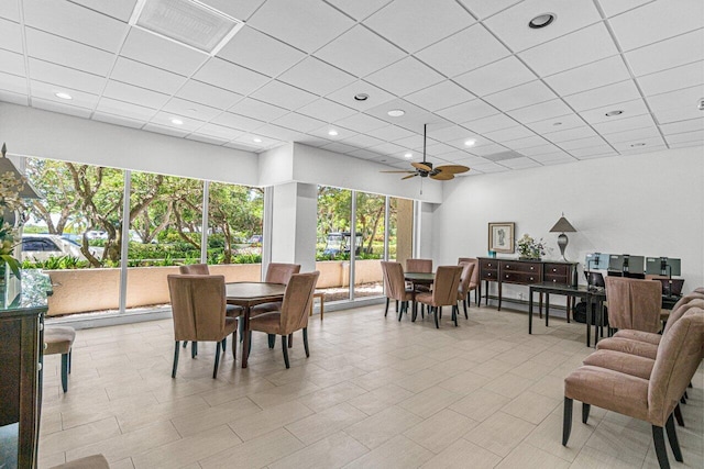 dining area featuring a paneled ceiling