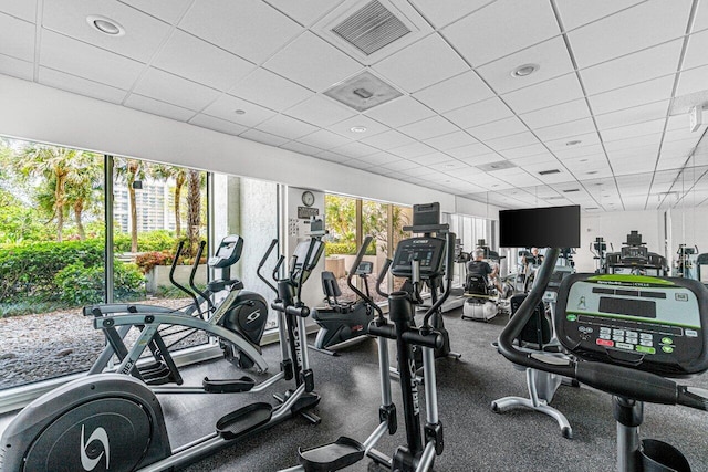 gym featuring a paneled ceiling